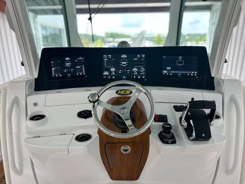 Slide: The Image of 2025 HCB Lujo boat helm with modern controls and digital displays. - 43
