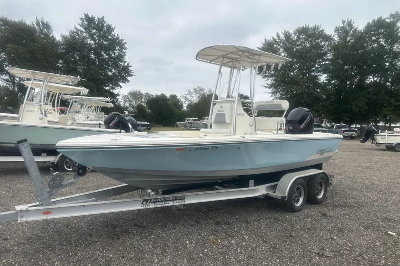 The Image of Pathfinder 2005 TRS boat on trailer, parked outdoors, 2023 model. - 1