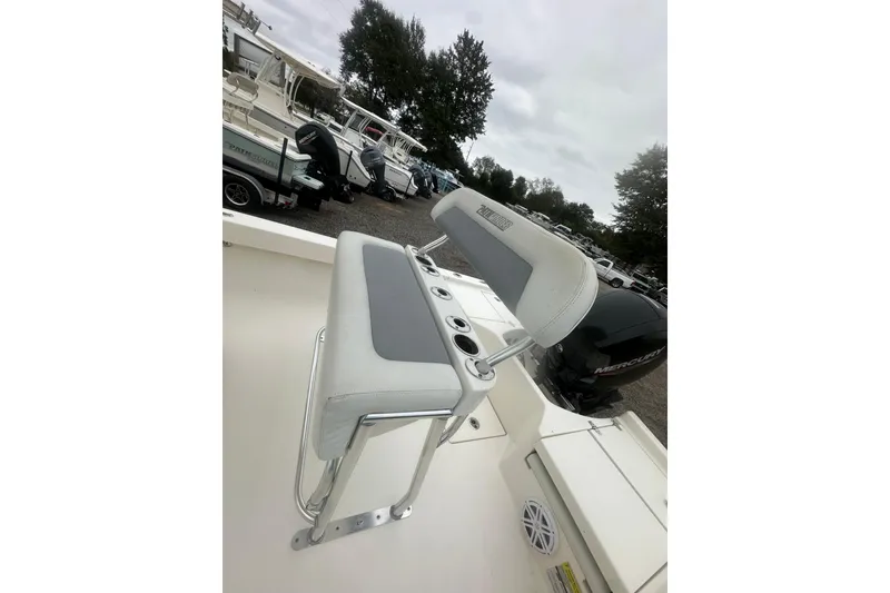 Slide: The Image of Boat seating on a 2023 Pathfinder 2005 TRS, featuring cup holders and a Mercury engine. - 13