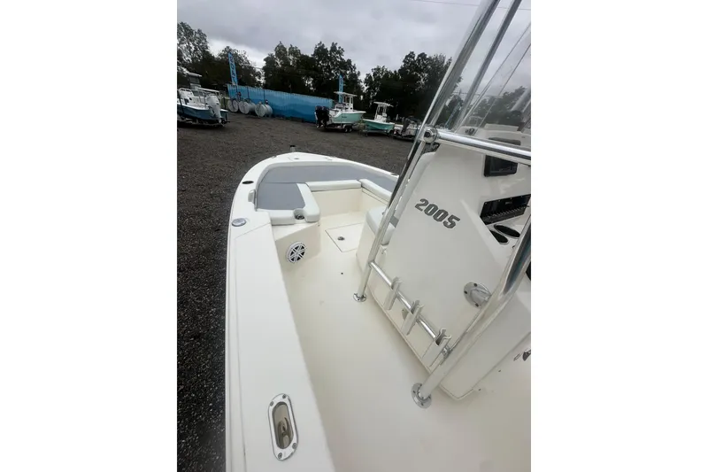 Slide: The Image of Pathfinder 2005 TRS boat, white deck, outdoor display, overcast sky, 2023 model. - 15