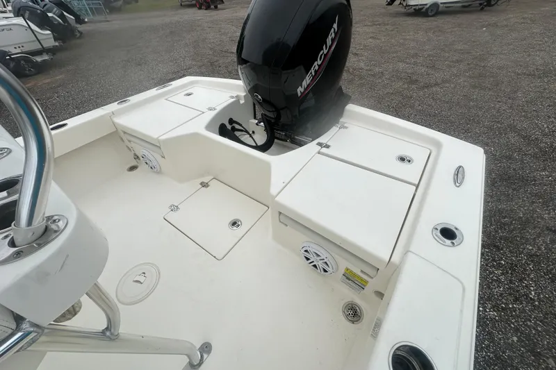 Slide: The Image of Pathfinder 2005 TRS boat deck with Mercury engine, storage compartments, and rod holders. - 16