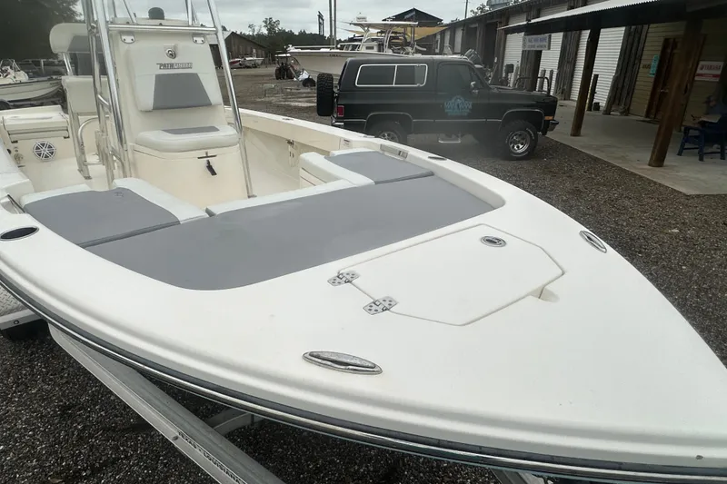 Slide: The Image of Pathfinder 2005 TRS boat on trailer, parked near a building, 2023 model. - 9