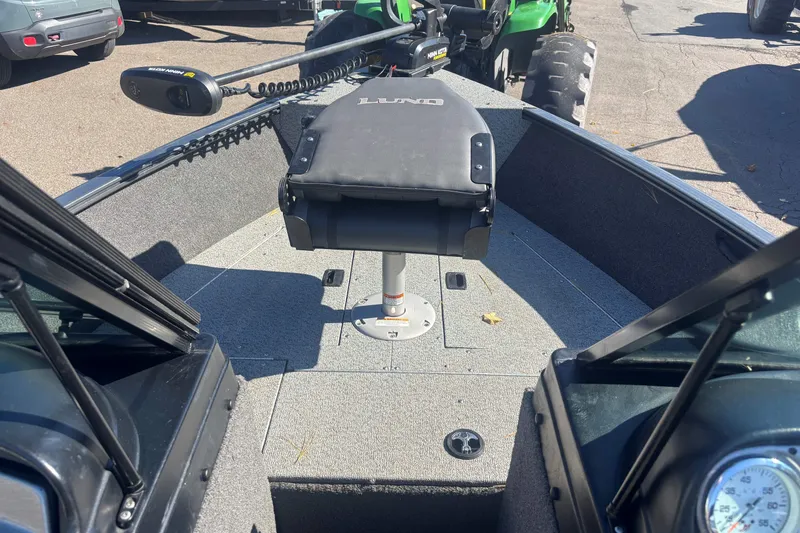 Slide: The Image of 2021 Lund 1650 Rebel XL Sport boat interior with seating and control panel. - 13