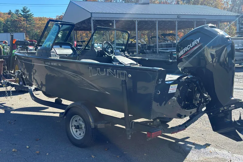 Slide: The Image of 2021 Lund 1650 Rebel XL Sport boat with Mercury outboard motor on trailer. - 8