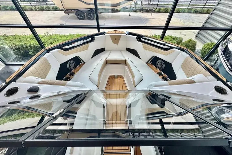 Slide: The Image of 2026 Nautique Super Air Nautique S23 boat interior with luxurious seating and modern design. - 6