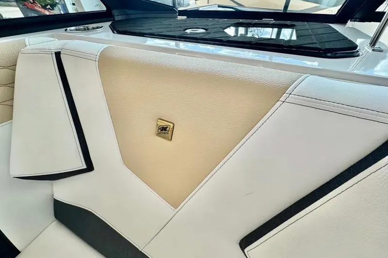 Slide: The Image of 2026 Nautique Super Air Nautique S23 interior with beige and white upholstery. - 8