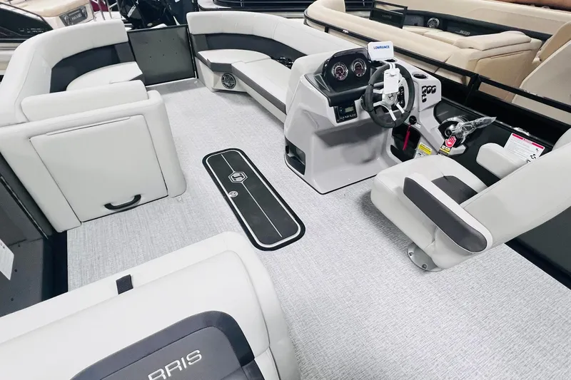 Slide: The Image of 2025 Harris Cruiser 230 interior with modern seating and steering console. - 11