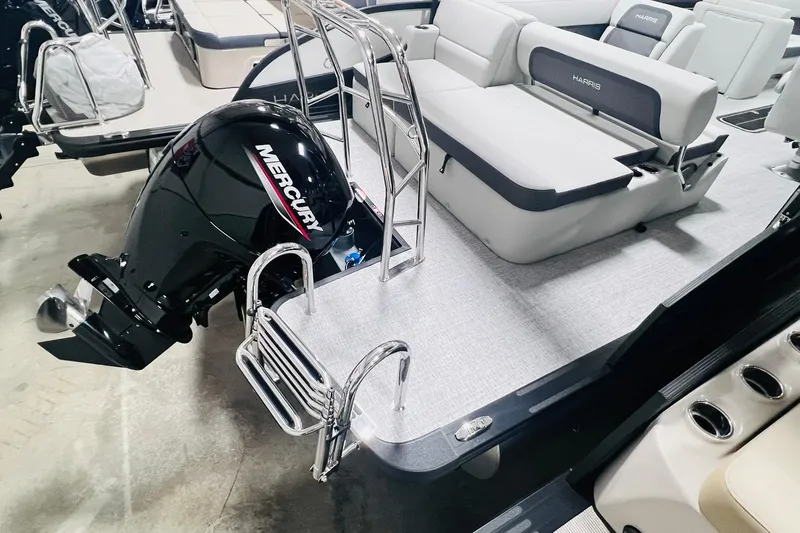 Slide: The Image of 2025 Harris Cruiser 230 boat with Mercury engine and comfortable seating. - 12
