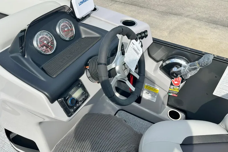 Slide: The Image of 2025 Harris Cruiser 230 dashboard with steering wheel and control panel. - 16