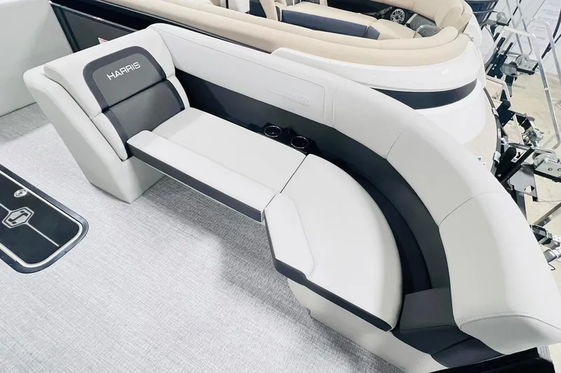 Slide: The Image of 2025 Harris Cruiser 230 boat interior with sleek, modern seating and cup holders. - 20