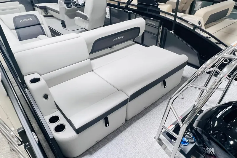 Slide: The Image of 2025 Harris Cruiser 230 interior with plush seating and modern design. - 21