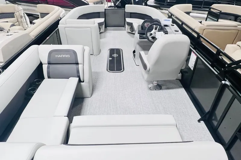 Slide: The Image of 2025 Harris Cruiser 230 interior with modern seating and steering console. - 22