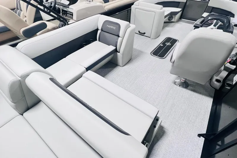 Slide: The Image of 2025 Harris Cruiser 230 interior with sleek seating and modern design. - 23