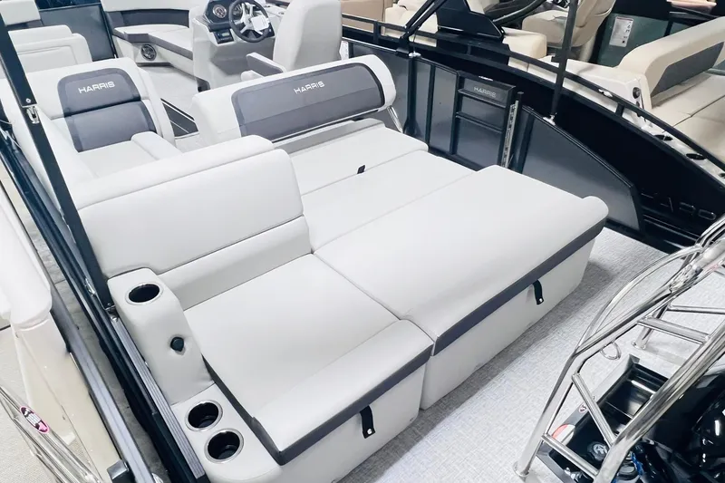 Slide: The Image of 2025 Harris Cruiser 230 interior with plush seating and modern dashboard. - 24