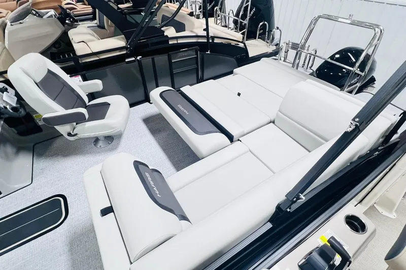 Slide: The Image of 2025 Harris Cruiser 230 interior with plush seating and modern design. - 27