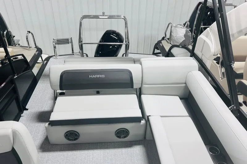 Slide: The Image of 2025 Harris Cruiser 230 boat interior with white seating and modern design. - 30