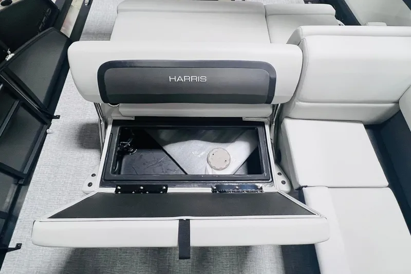 Slide: The Image of 2025 Harris Cruiser 230 boat seat with open storage compartment. - 31