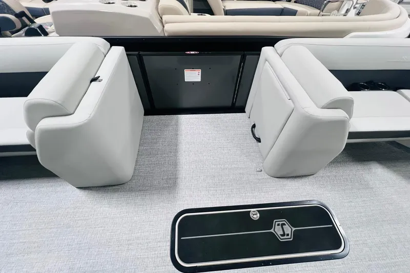 Slide: The Image of 2025 Harris Cruiser 230 interior with plush seating and sleek flooring. - 35