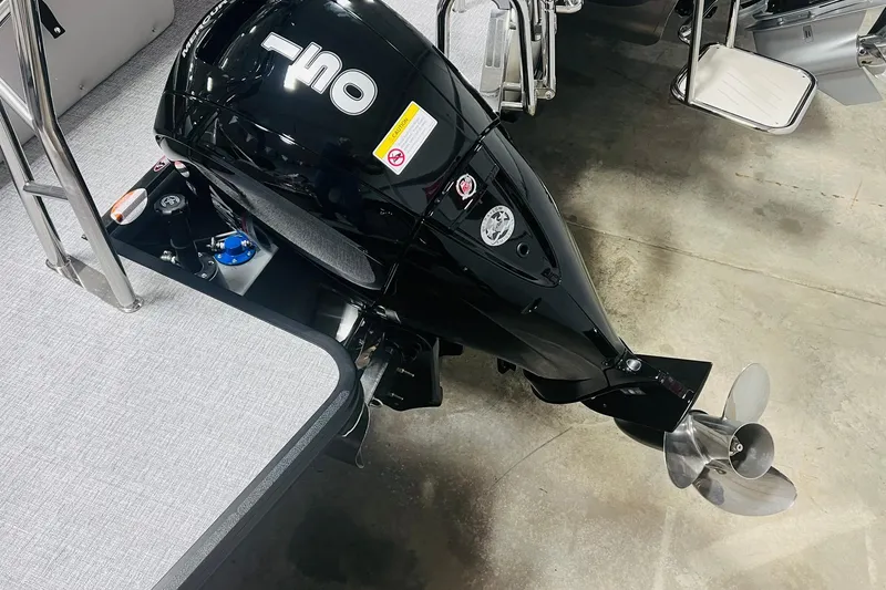 Slide: The Image of Outboard motor on 2025 Harris Cruiser 230 pontoon boat, featuring a sleek black design. - 44