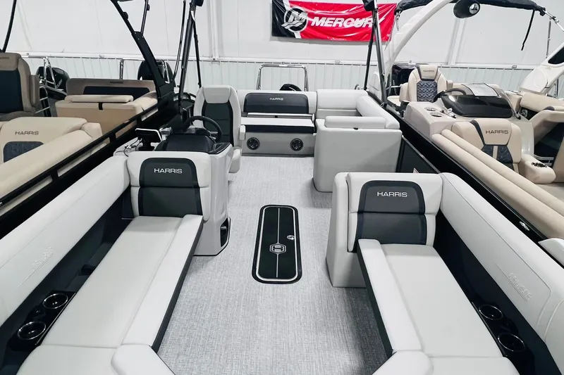 Slide: The Image of 2025 Harris Cruiser 230 pontoon boat interior with luxurious seating and modern design. - 5
