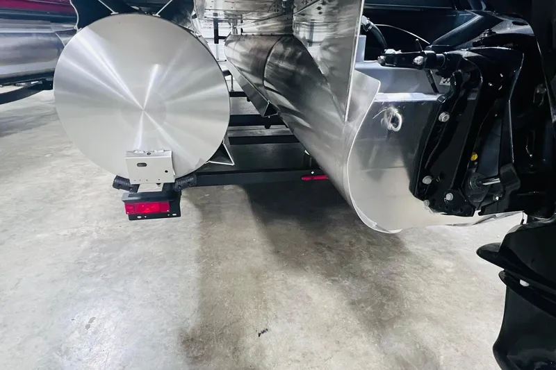 Slide: The Image of Rear view of 2025 Harris Cruiser 230 pontoon boat on a trailer. - 50