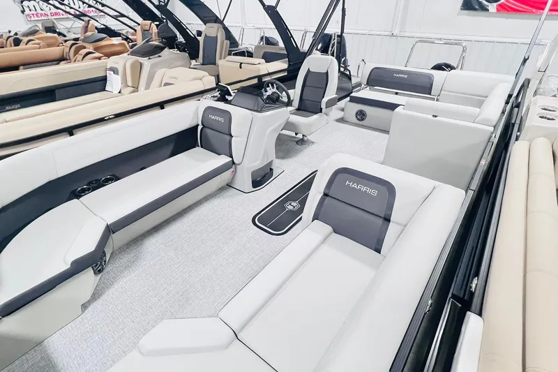 Slide: The Image of 2025 Harris Cruiser 230 interior with modern seating and sleek design. - 6