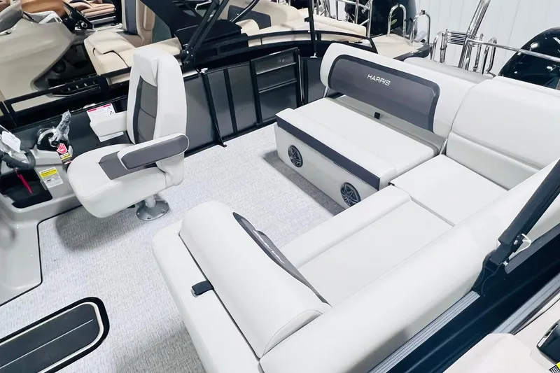 Slide: The Image of 2025 Harris Cruiser 230 interior with plush seating and modern design. - 8