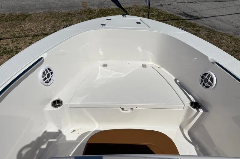 Slide: The Image of 2026 Robalo R180 Center Console boat interior with speakers and storage compartment. - 8