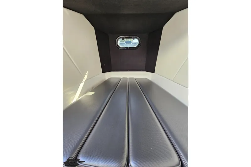 Slide: The Image of 2020 Sunsation 32 CCX cabin interior with cushioned seating and small window. - 119