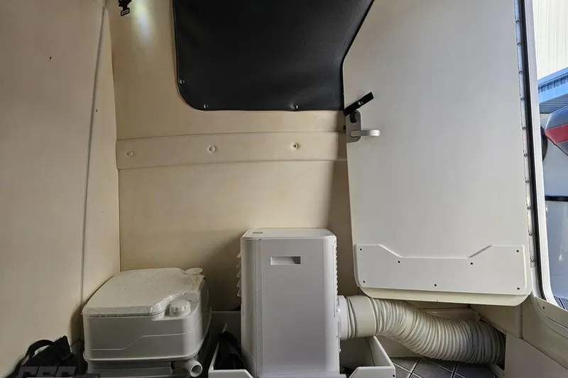 Slide: The Image of Interior of 2020 Sunsation 32 CCX boat with storage compartment and equipment. - 121