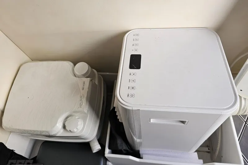 Slide: The Image of Compact appliances in a 2020 Sunsation 32 CCX boat interior. - 122