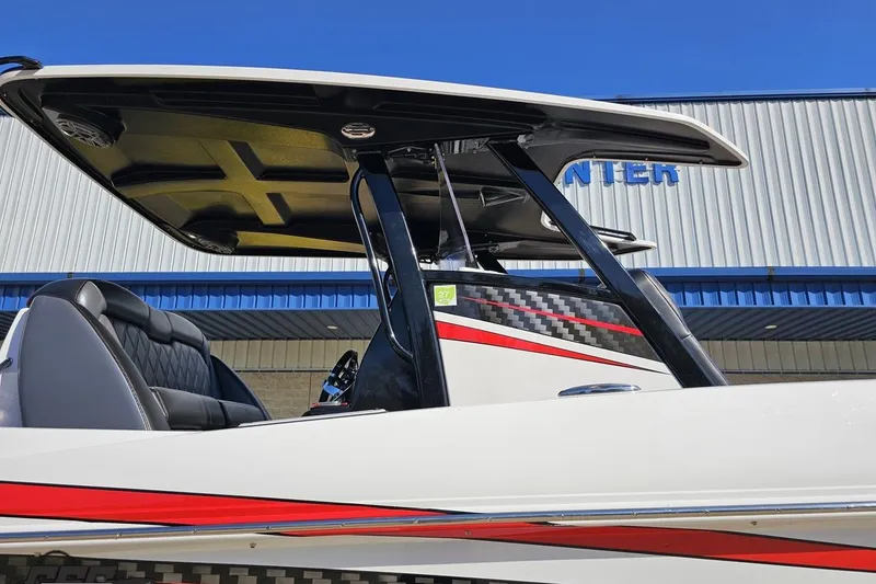 Slide: The Image of 2020 Sunsation 32 CCX boat with sleek design, red accents, and modern seating. - 17