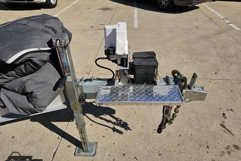 Slide: The Image of Trailer hitch setup for 2020 Sunsation 32 CCX boat, featuring a winch and cover. - 20