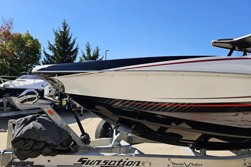 Slide: The Image of 2020 Sunsation 32 CCX boat on trailer, sleek design, sunny day. - 26