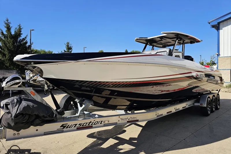 Slide: The Image of 2020 Sunsation 32 CCX boat on trailer, sleek design, parked outdoors. - 27