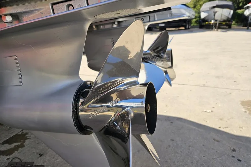 Slide: The Image of Close-up of 2020 Sunsation 32 CCX boat propellers, showcasing sleek, polished metal design. - 39