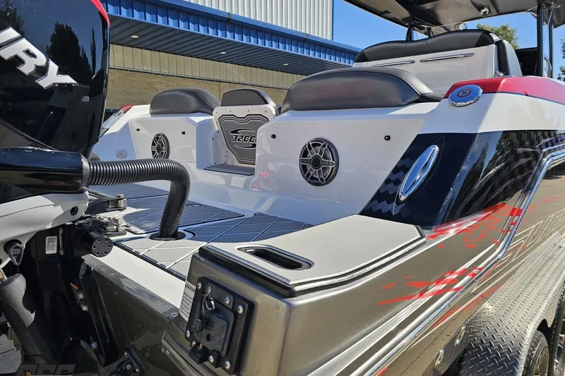 Slide: The Image of 2020 Sunsation 32 CCX boat rear view with sleek design and powerful engine. - 43