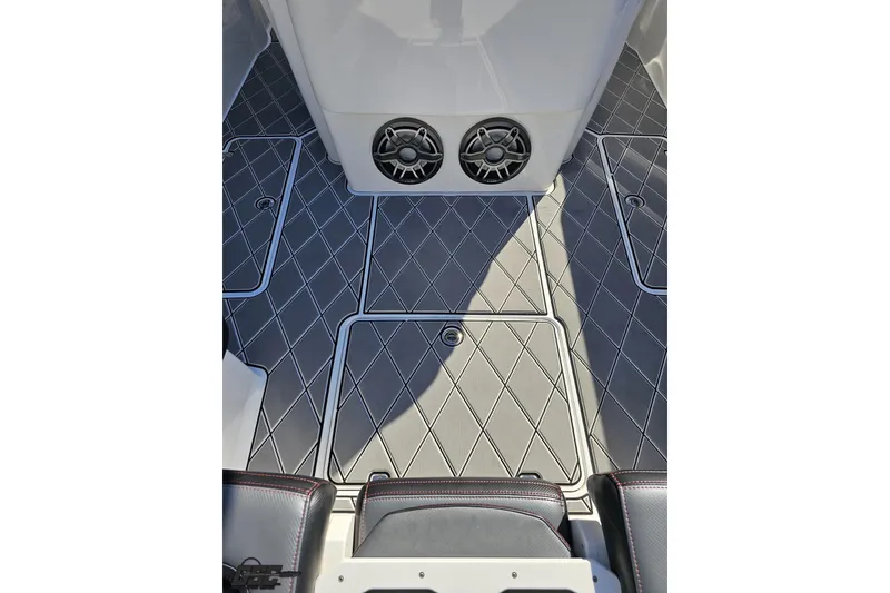 Slide: The Image of 2020 Sunsation 32 CCX boat interior with diamond-patterned flooring and speaker system. - 58