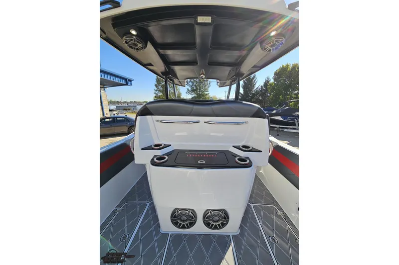 Slide: The Image of 2020 Sunsation 32 CCX boat interior with speakers and seating, showcasing modern design. - 59