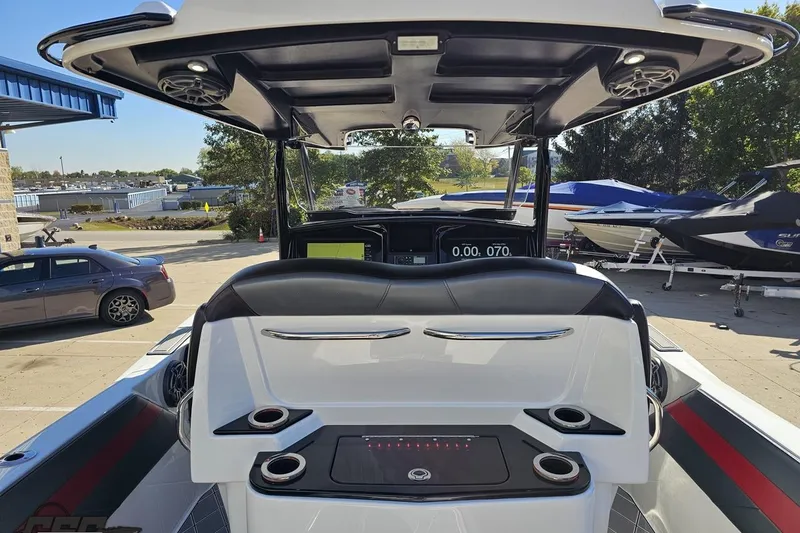 Slide: The Image of 2020 Sunsation 32 CCX boat interior with modern dashboard and seating. - 60