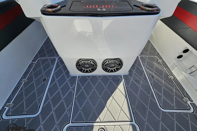 Slide: The Image of 2020 Sunsation 32 CCX boat interior with diamond-patterned flooring and built-in speakers. - 61