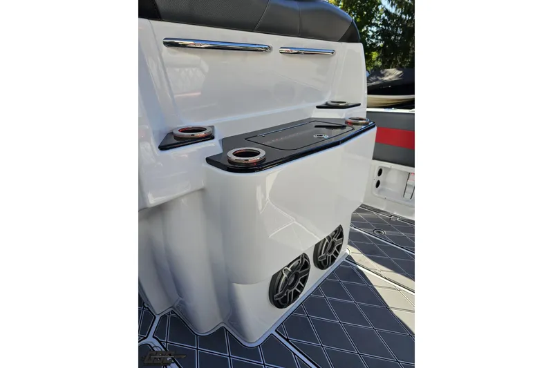 Slide: The Image of 2020 Sunsation 32 CCX boat interior with cup holders and speakers. - 64