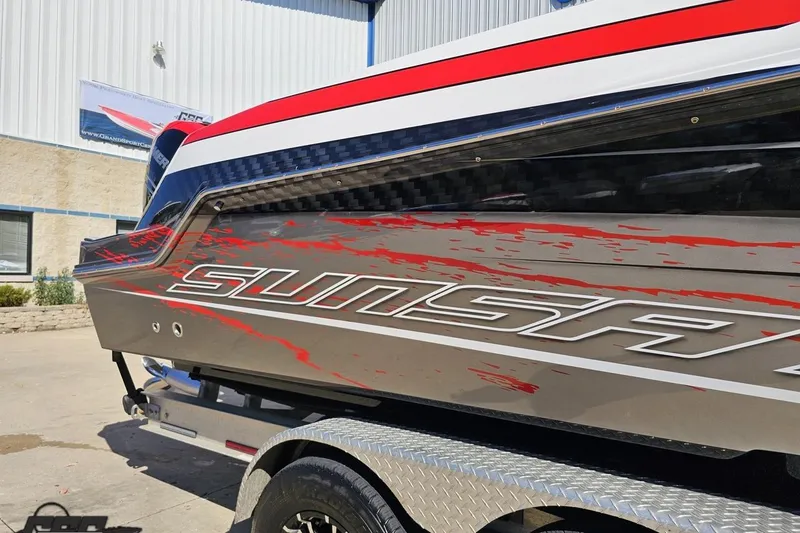 Slide: The Image of 2020 Sunsation 32 CCX boat with sleek design and vibrant red accents. - 7