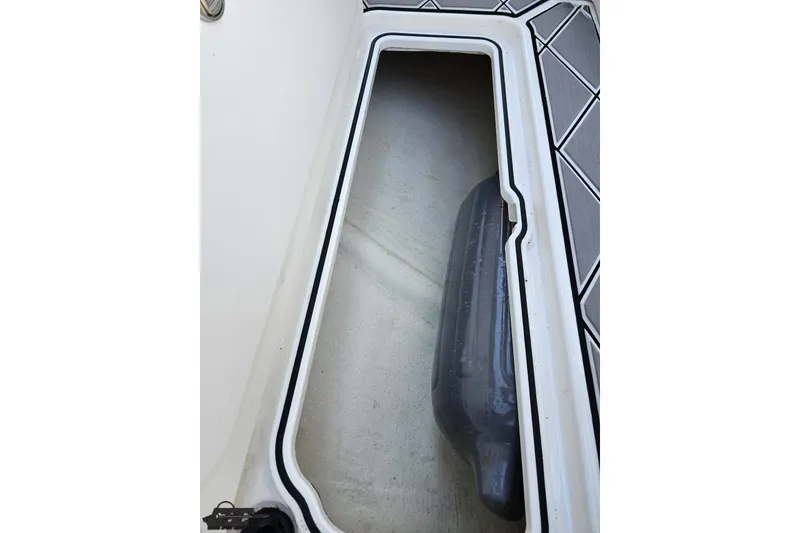 Slide: The Image of Storage compartment of 2020 Sunsation 32 CCX boat, featuring sleek interior design. - 71