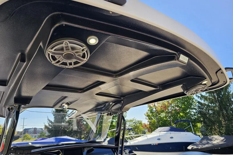 Slide: The Image of 2020 Sunsation 32 CCX boat roof with speakers and lighting, outdoor setting. - 72