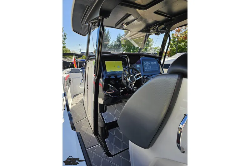 Slide: The Image of 2020 Sunsation 32 CCX boat interior with modern dashboard and steering wheel. - 73