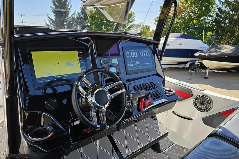 Slide: The Image of 2020 Sunsation 32 CCX boat dashboard with advanced navigation and control systems. - 74