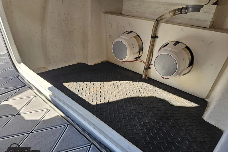 Slide: The Image of 2020 Sunsation 32 CCX boat interior with speakers and textured flooring. - 79