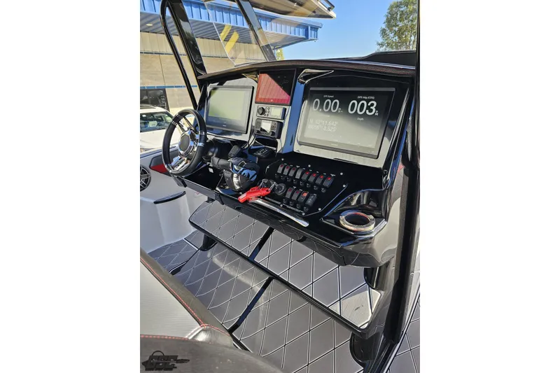 Slide: The Image of 2020 Sunsation 32 CCX boat dashboard with modern controls and navigation screens. - 86