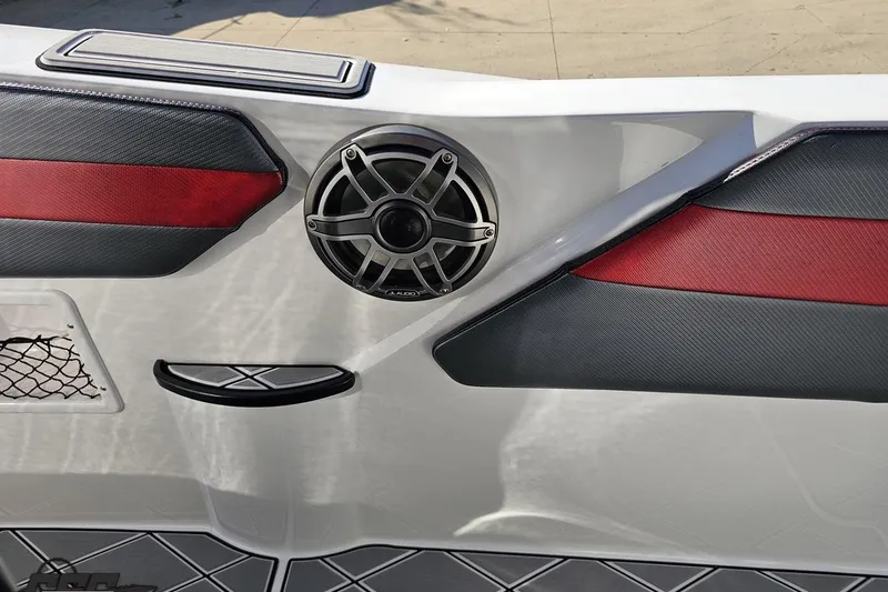 Slide: The Image of 2020 Sunsation 32 CCX boat interior with speaker and red-black accents. - 89